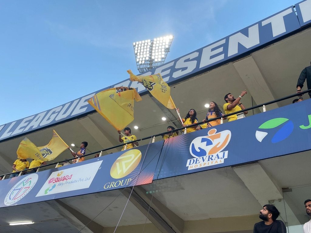 Bhopal Leopards fans waving flags at the stadium